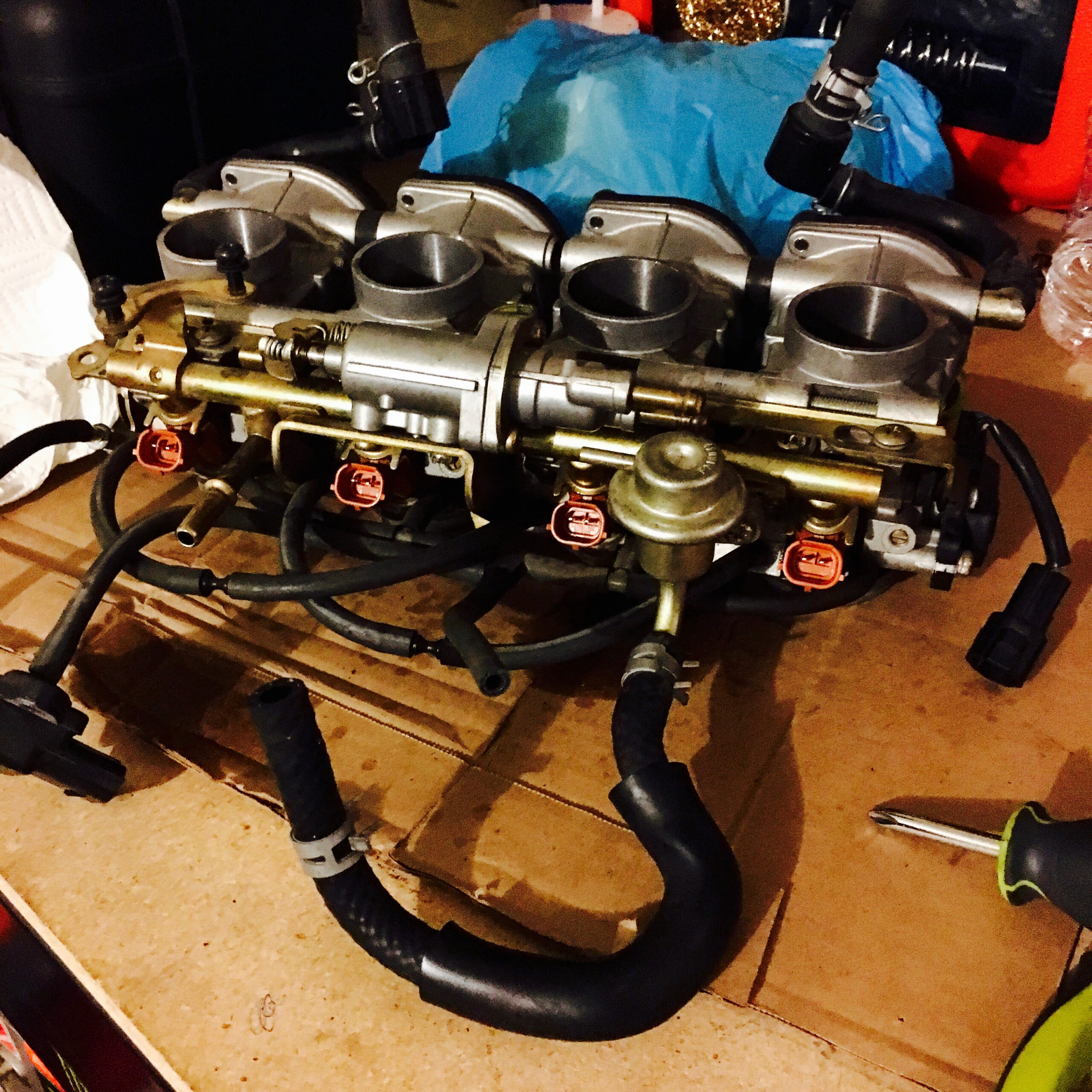 Disassembling to clean the fuel injectors and replace seals.